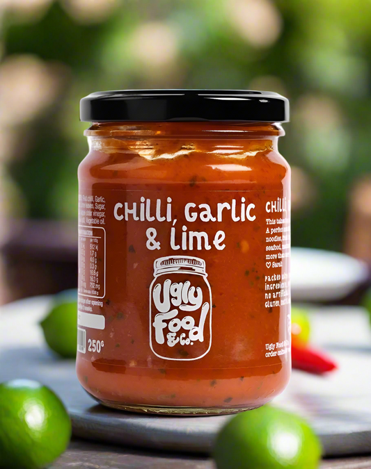 Jar of Ugly Food & Co chili garlic lime sauce on a white background