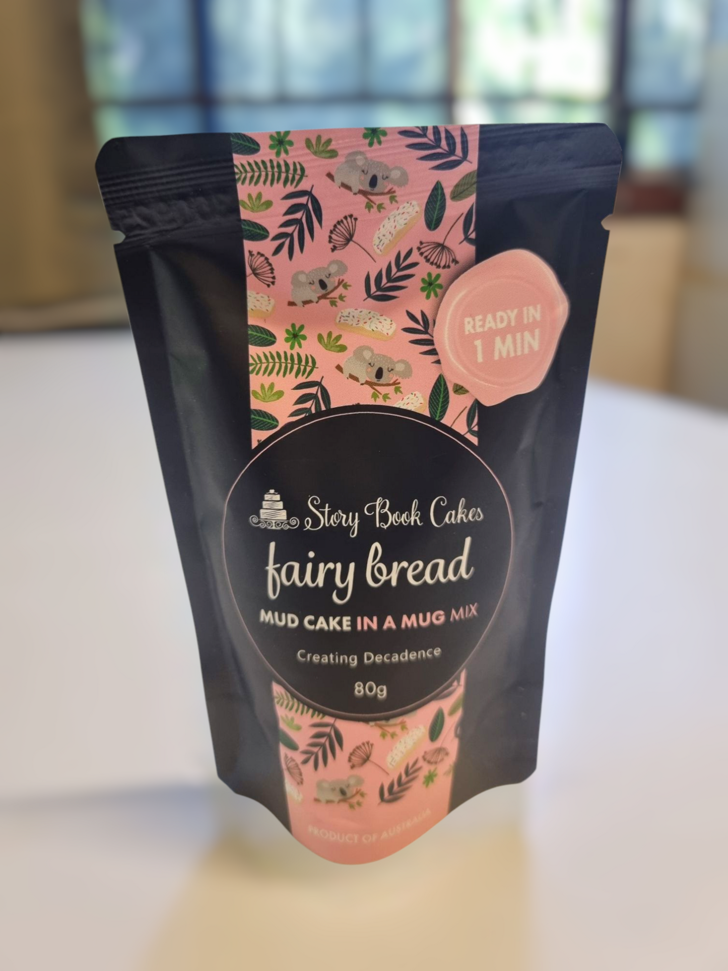 Package of fairy bread mix with pink and black design on a light background