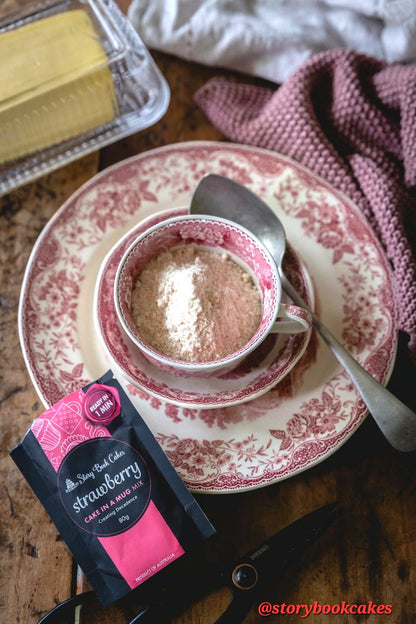 Cup of coffee with a strawberry flavor packet on a vintage plate