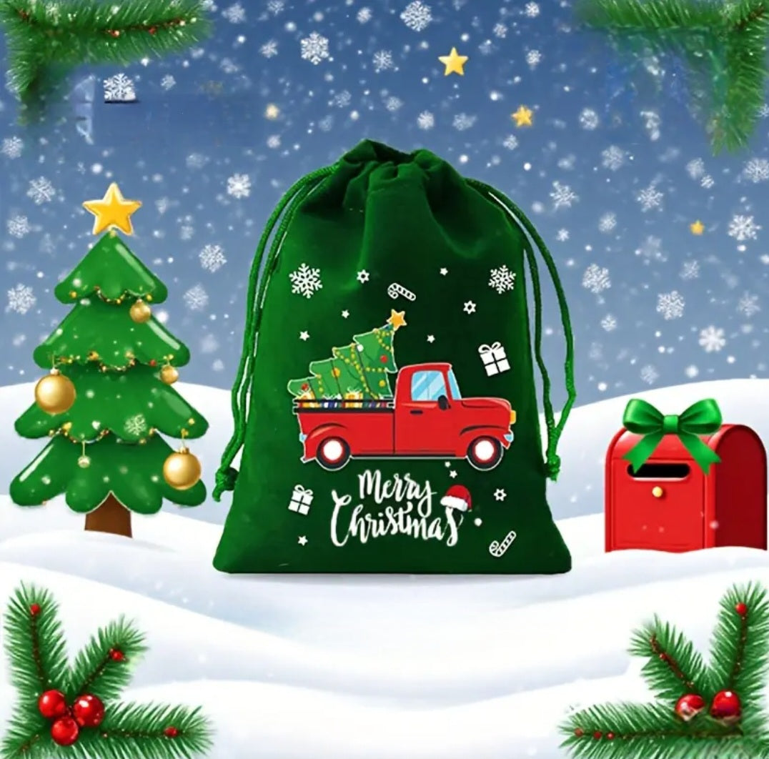 Green drawstring bag with Christmas truck design on a snowy background with tree and mailbox.