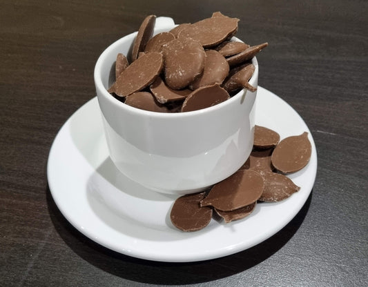 A cup full of delicious peppermint carob buttons